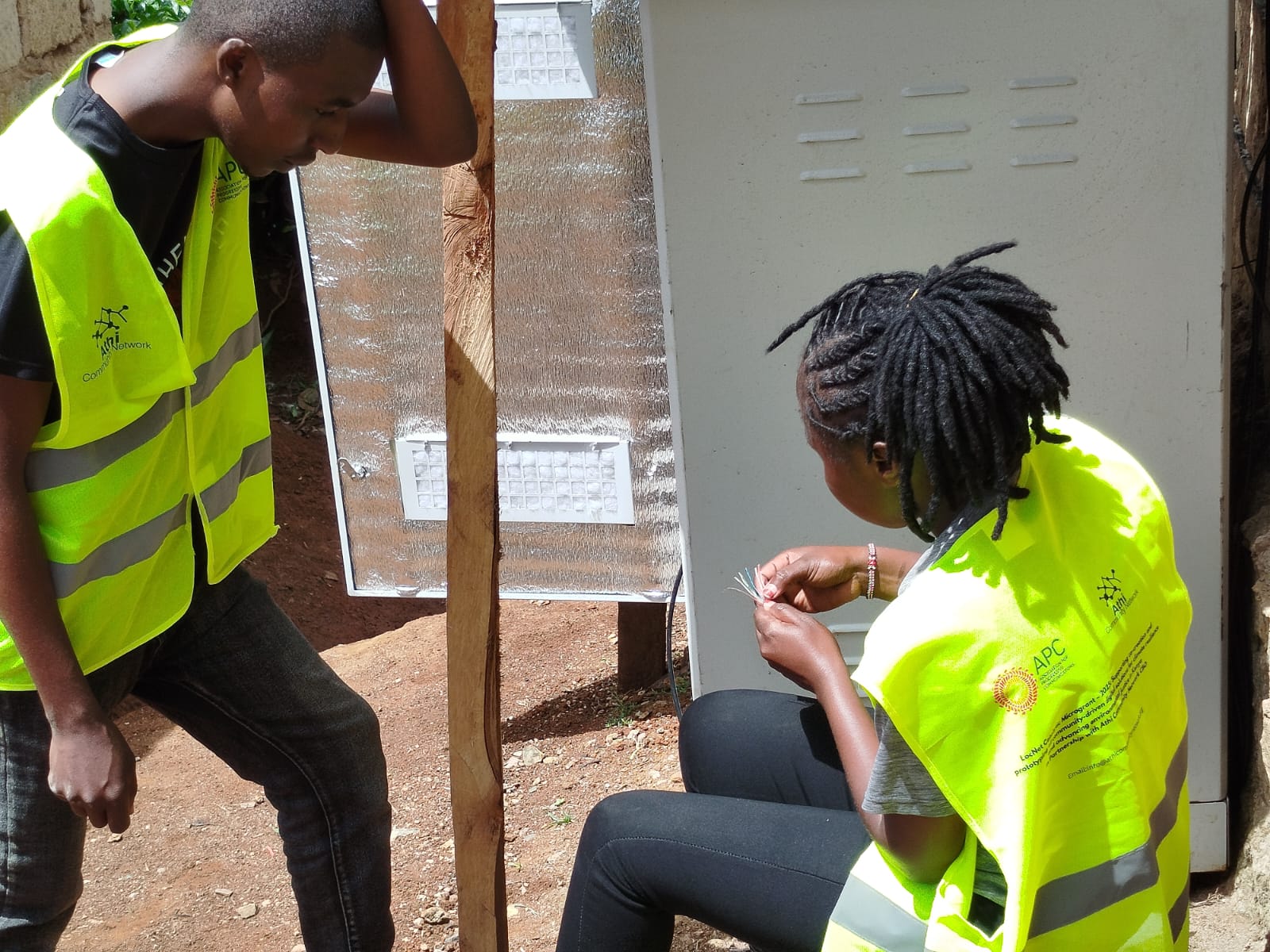 AthiCN technicians working with network cabling